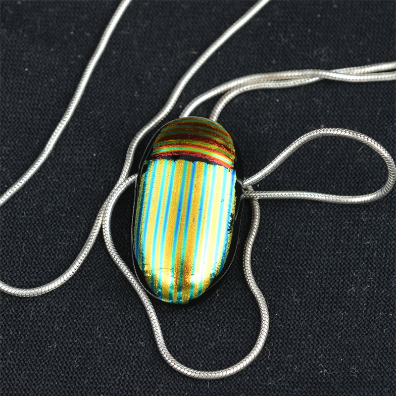 Fused Glass Pendant, Scarab red/green, by Bruce St. John Maher, on silver chain