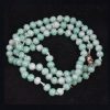 Strand of Antique Green and White Crumb Beads